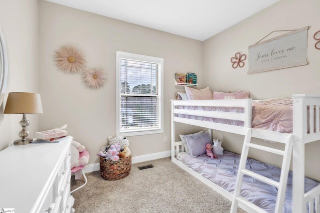 carpeted bedroom with visible vents and baseboards