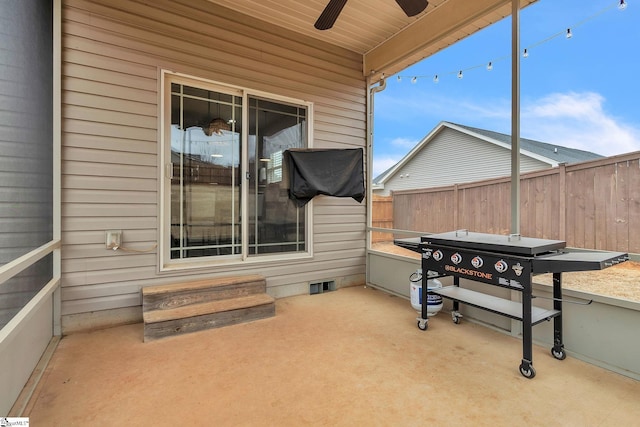 view of patio / terrace featuring fence and a ceiling fan