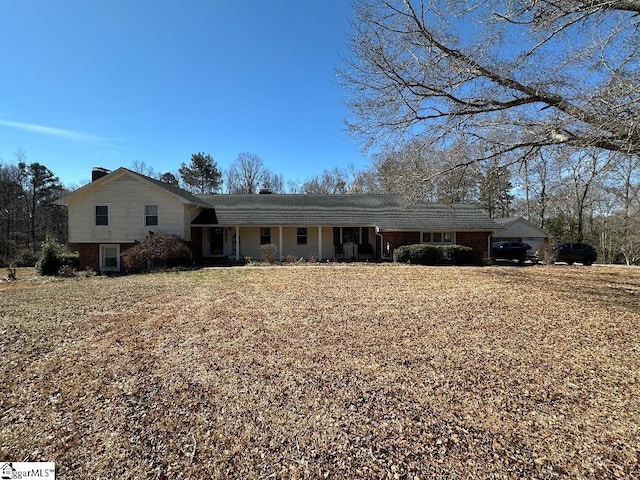 view of front of property featuring brick siding