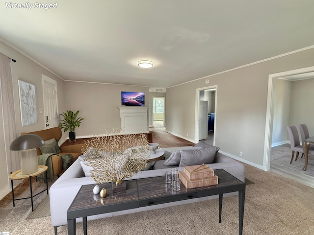 carpeted living room with baseboards and crown molding