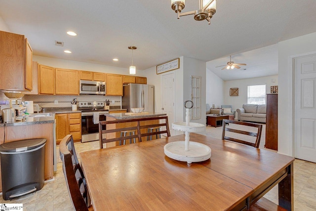 dining space featuring lofted ceiling, recessed lighting, visible vents, and a ceiling fan