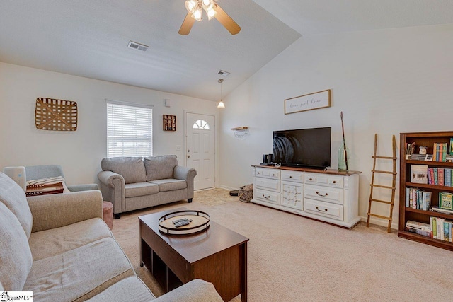 living area with a ceiling fan, visible vents, vaulted ceiling, and light carpet