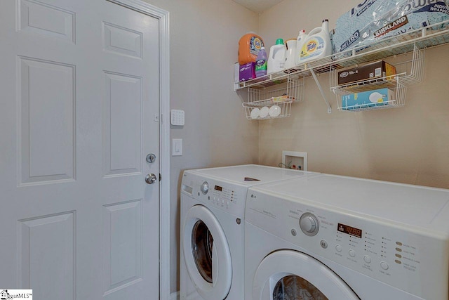 laundry area with laundry area and separate washer and dryer