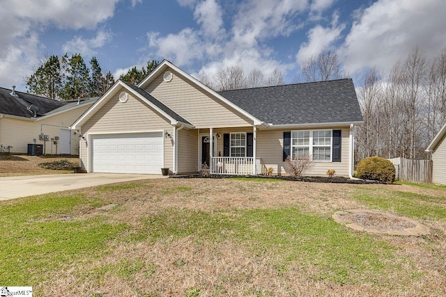 ranch-style house featuring concrete driveway, a porch, an attached garage, fence, and a front lawn