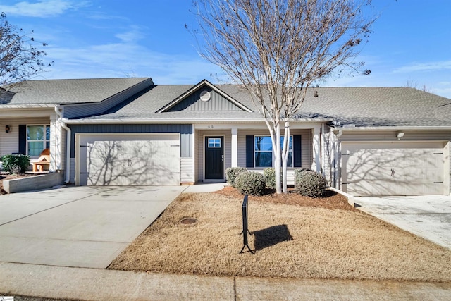 ranch-style house with board and batten siding, roof with shingles, driveway, and an attached garage