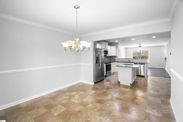 kitchen featuring baseboards, appliances with stainless steel finishes, white cabinetry, and tasteful backsplash