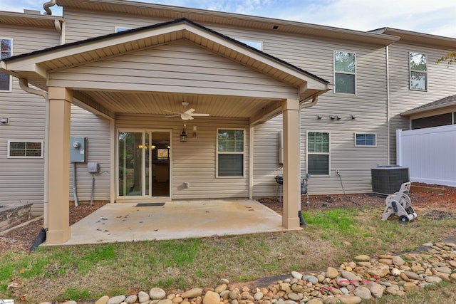 back of property with central AC, ceiling fan, fence, and a patio