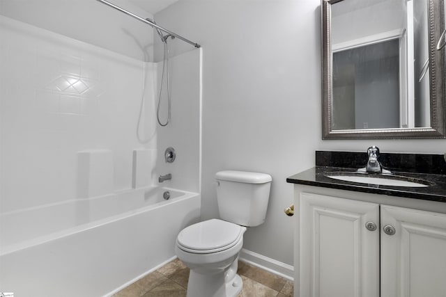 bathroom featuring bathtub / shower combination, vanity, toilet, and baseboards