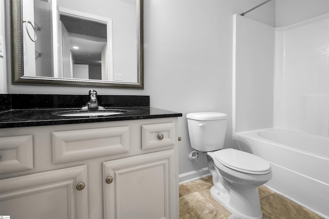 full bath with shower / washtub combination, vanity, toilet, and tile patterned floors