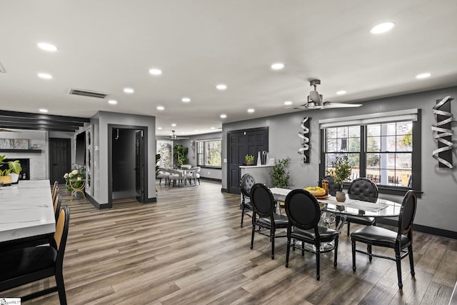 dining room with ceiling fan, visible vents, wood finished floors, and recessed lighting