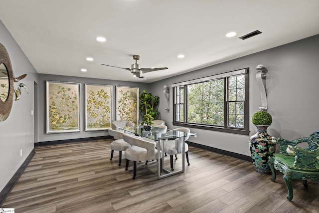 dining space with recessed lighting, visible vents, baseboards, and wood finished floors