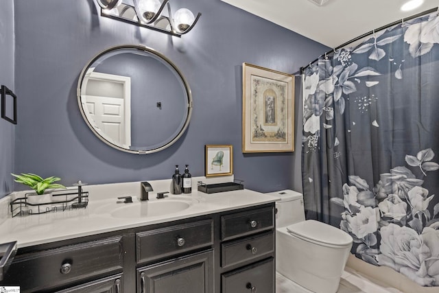 full bath featuring toilet, curtained shower, and vanity