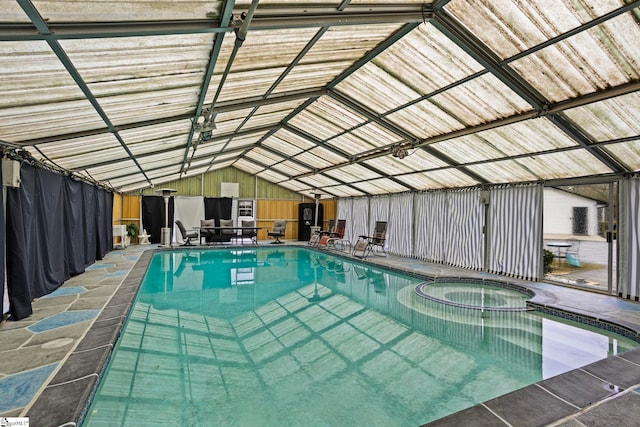 view of swimming pool with a pool with connected hot tub