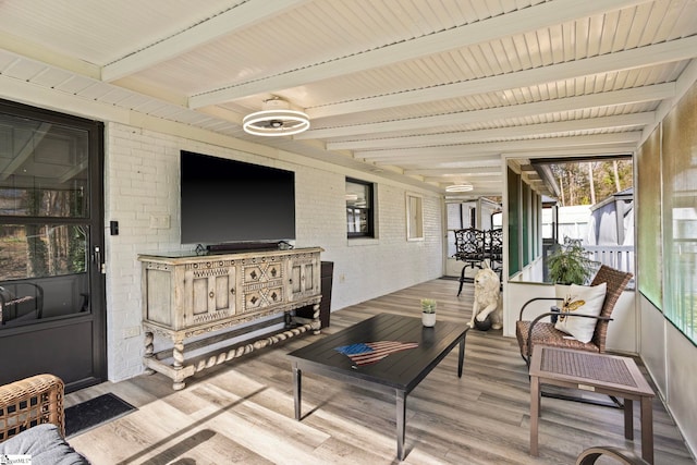 sunroom / solarium with beam ceiling