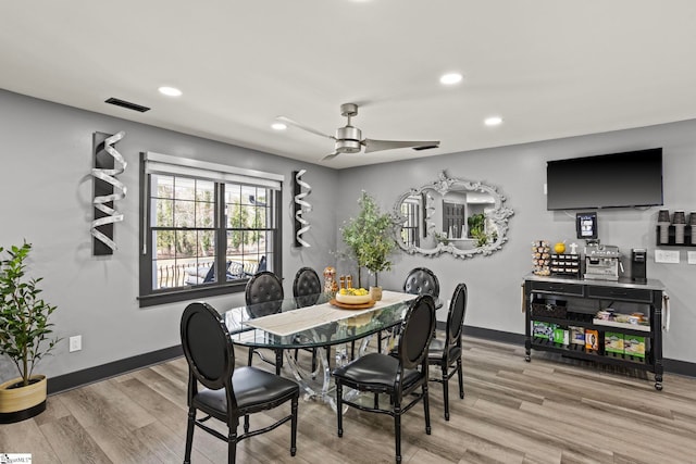 dining room with ceiling fan, recessed lighting, wood finished floors, and baseboards