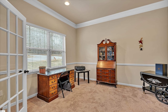 office space with light carpet, baseboards, and crown molding