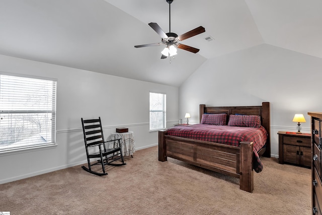 bedroom featuring lofted ceiling, light carpet, visible vents, and a ceiling fan