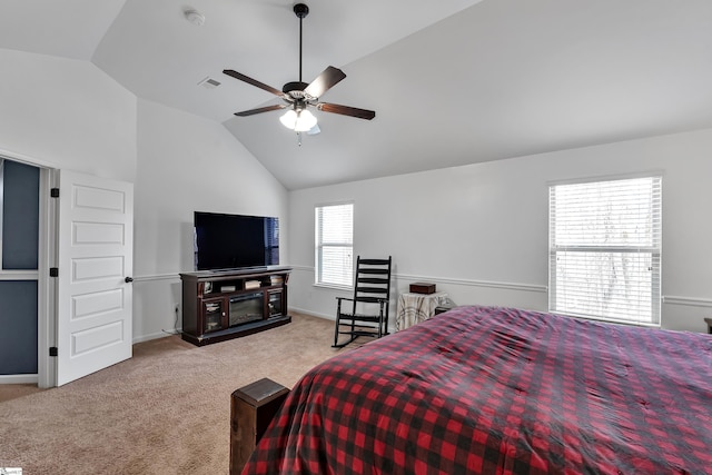 bedroom with carpet floors, a fireplace, visible vents, vaulted ceiling, and baseboards