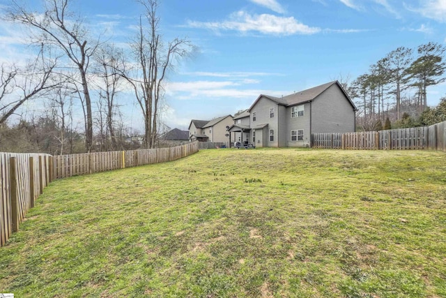 view of yard with a fenced backyard