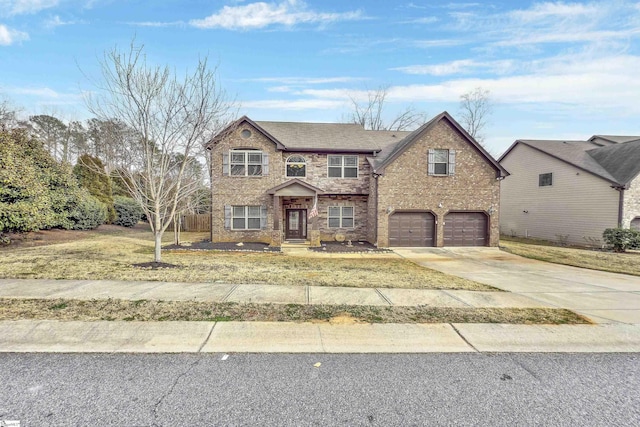 traditional-style home with a garage, roof with shingles, concrete driveway, and brick siding