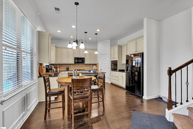 dining area featuring a chandelier, recessed lighting, dark wood-style flooring, visible vents, and stairs