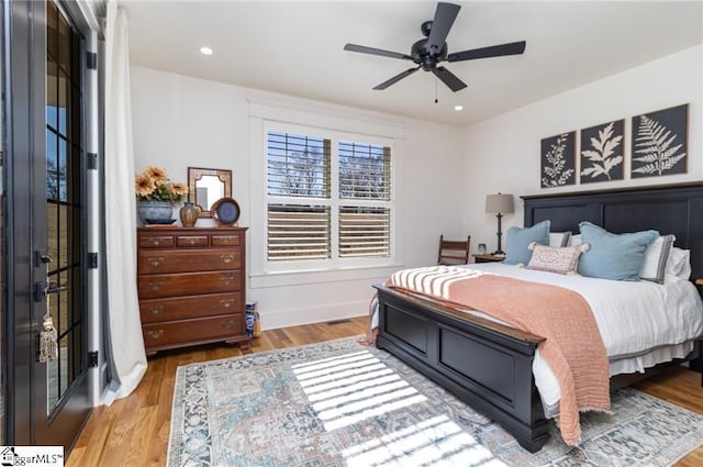 bedroom with recessed lighting, ceiling fan, and wood finished floors