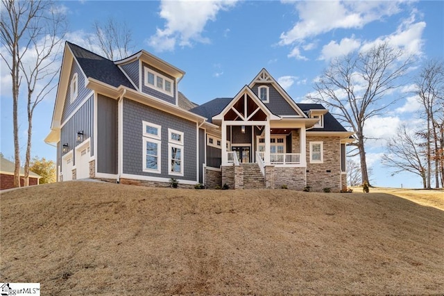 craftsman house with a garage and covered porch