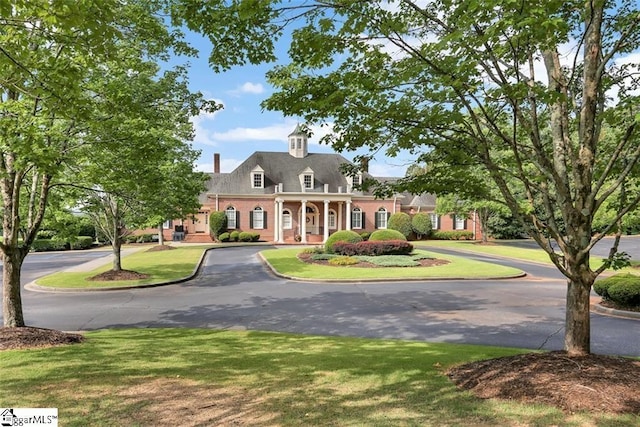 view of front of property with a front lawn and a porch