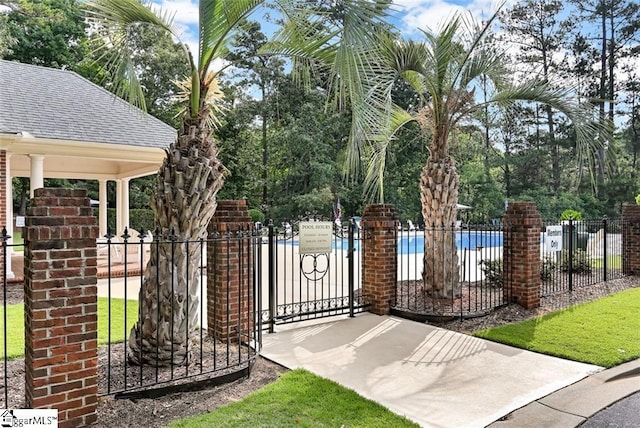 view of gate with fence