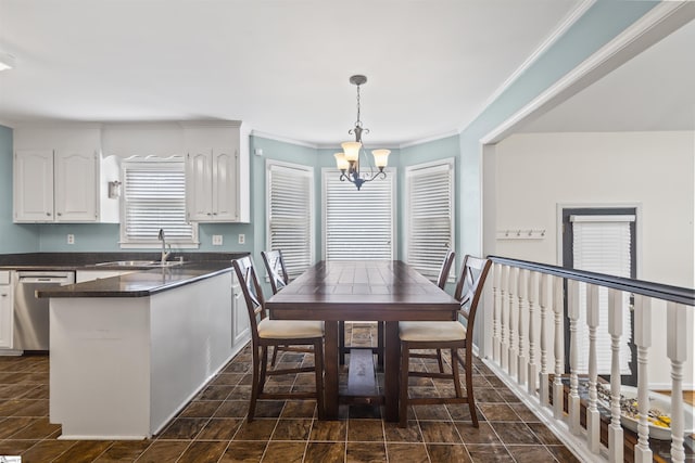 dining space with a chandelier and ornamental molding