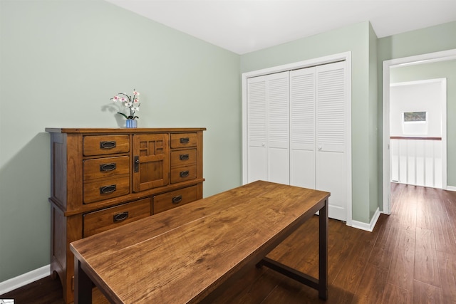 home office featuring dark wood-type flooring and baseboards