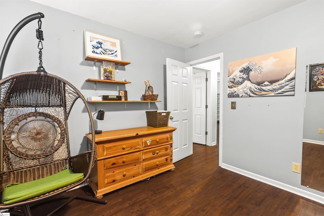 misc room featuring dark wood-style floors and baseboards