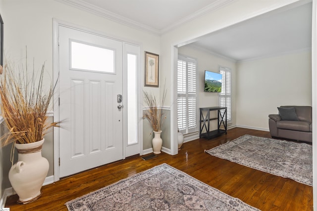 entryway featuring ornamental molding, baseboards, and wood finished floors