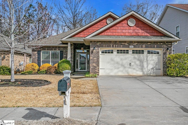 craftsman-style house featuring an attached garage and concrete driveway