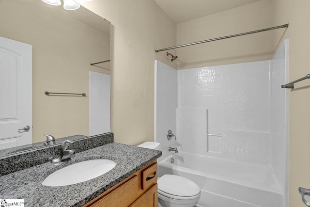 bathroom with toilet, tub / shower combination, and vanity