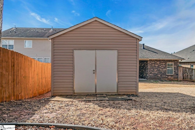 view of shed with a fenced backyard