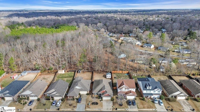 bird's eye view with a forest view and a residential view