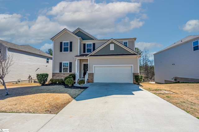 craftsman house featuring brick siding, an attached garage, board and batten siding, driveway, and a front lawn