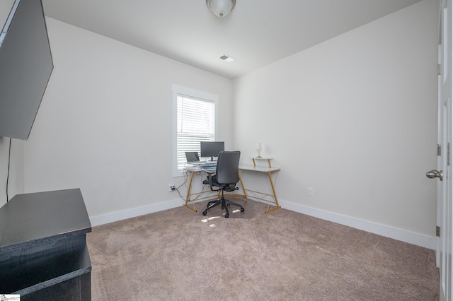 carpeted home office with visible vents and baseboards