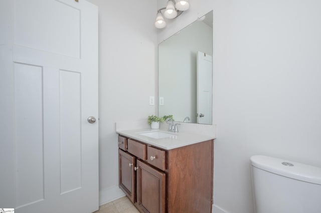 bathroom with toilet and vanity