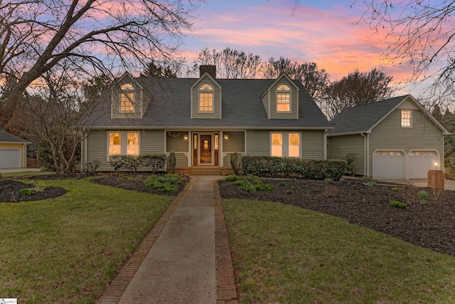 cape cod-style house with a lawn