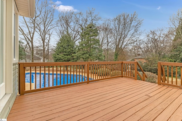 wooden deck with an outdoor pool