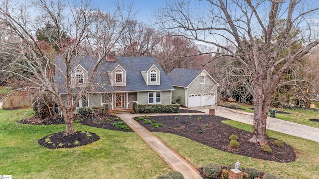 new england style home featuring a porch, a front yard, concrete driveway, and a garage