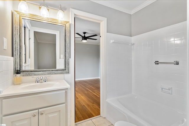 full bathroom featuring ceiling fan, tile patterned flooring, vanity, tub / shower combination, and crown molding