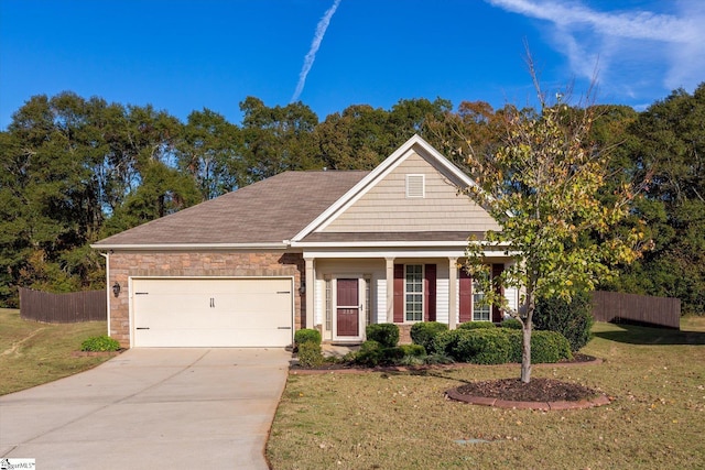 view of front of house with concrete driveway, a front lawn, an attached garage, and fence