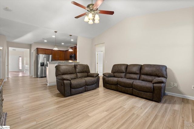 living area featuring lofted ceiling, light wood-style flooring, recessed lighting, a ceiling fan, and baseboards