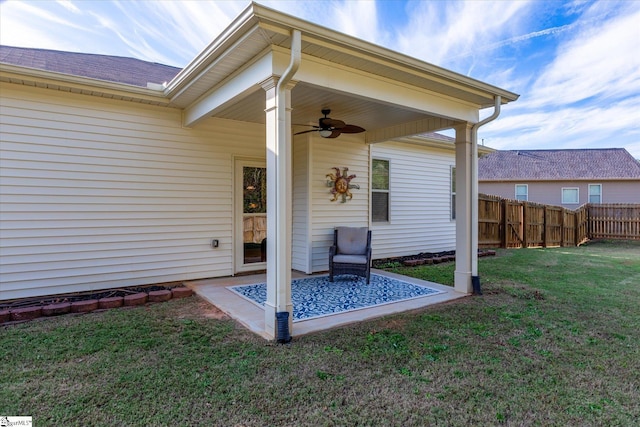 view of patio / terrace with fence and a ceiling fan