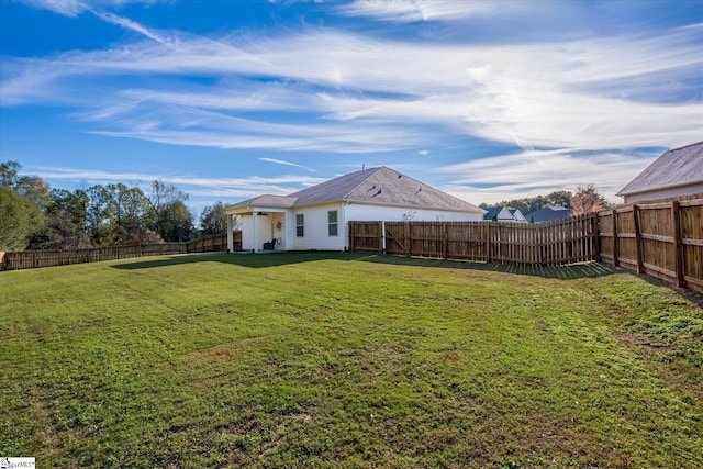 view of yard with a fenced backyard