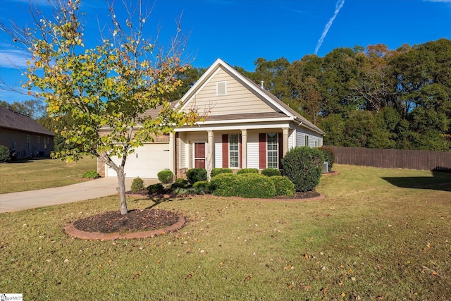 view of front facade featuring an attached garage, concrete driveway, a front yard, and fence