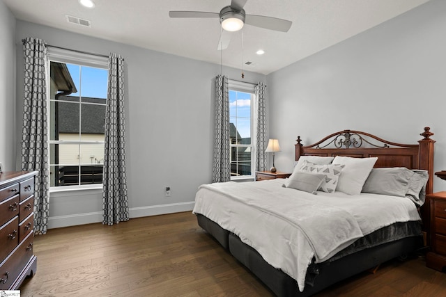 bedroom featuring recessed lighting, visible vents, baseboards, and wood finished floors